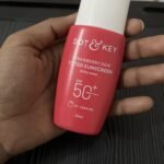 Hand holding Dot & Key Strawberry Dew Tinted Sunscreen SPF 50+ PA++++ 50ml shade 07 Caramel for daily sun protection review