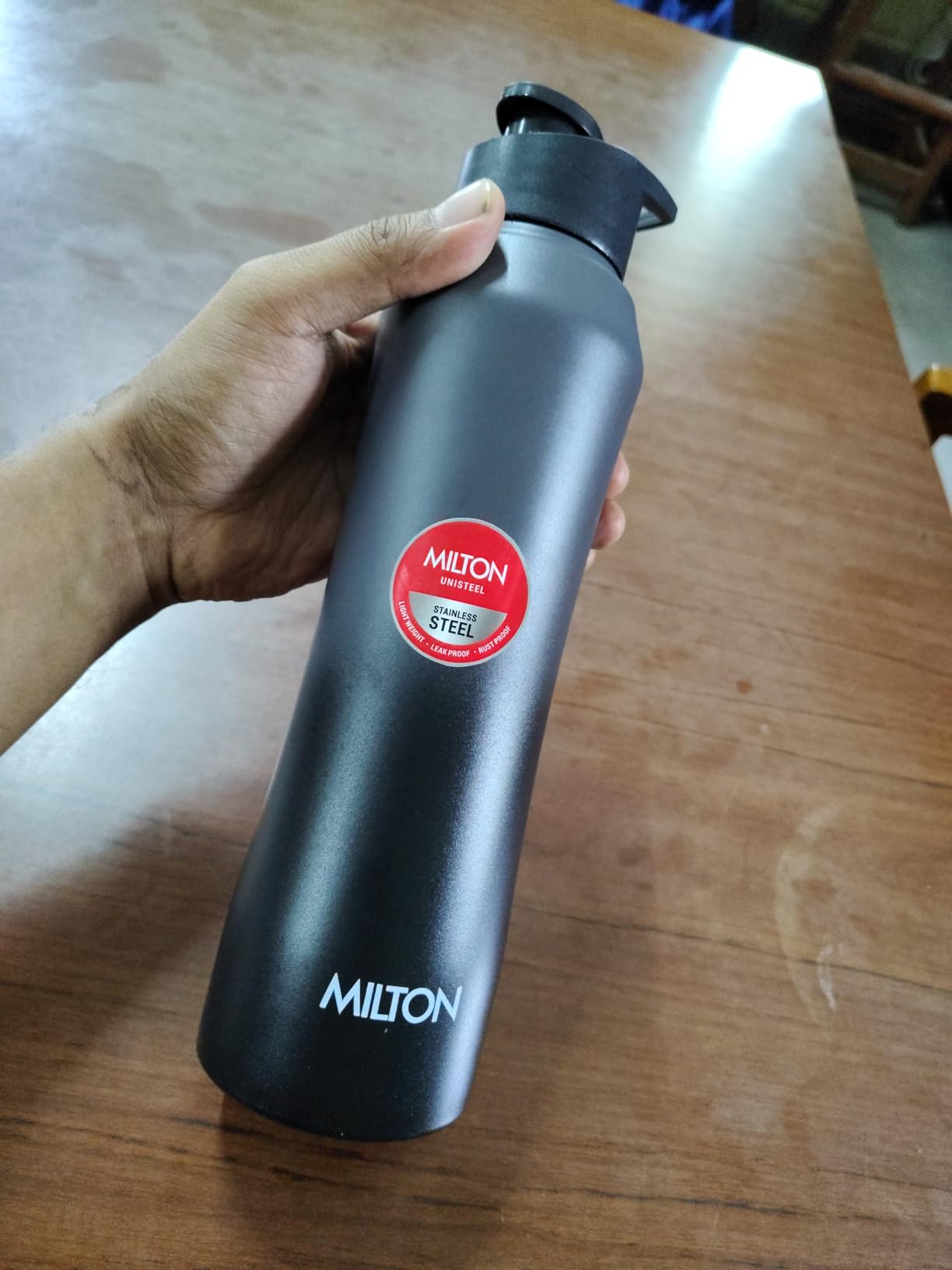 MILTON Comet stainless steel water bottle in black color with leak-proof lid, suitable for office, gym, school and daily use.